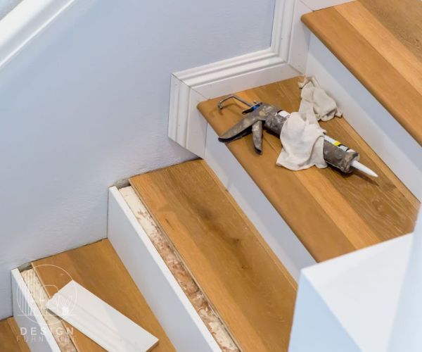 Hardwood Floor Installation On Stairs with white skirting